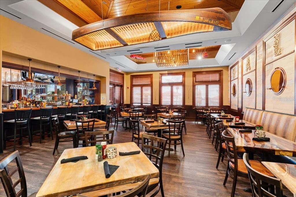 102 Riviera Dunes Way, Unit S36 Palmetto, FL 34221 - Photo 20 of 24 a room with lots of tables and chairs