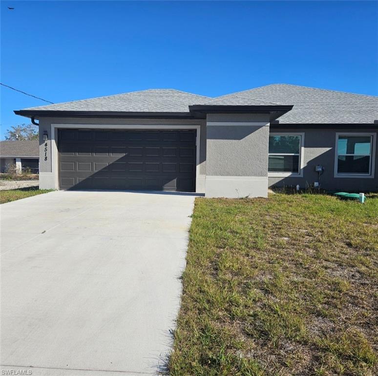 4518 26th Street Southwest Lehigh Acres, FL 33973 - Photo 1 of 15 a front view of a house with yard