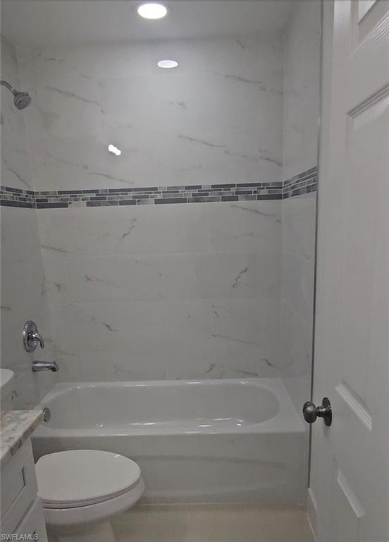 4518 26th Street Southwest Lehigh Acres, FL 33973 - Photo 13 of 15 a bathroom with a shower and a toilet