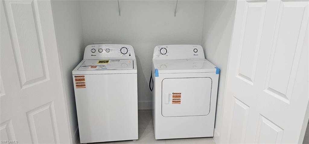 4518 26th Street Southwest Lehigh Acres, FL 33973 - Photo 3 of 15 a utility room with dryer and washer