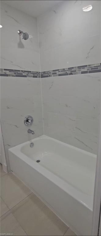 4518 26th Street Southwest Lehigh Acres, FL 33973 - Photo 10 of 15 a bathroom with a shower and a bathtub
