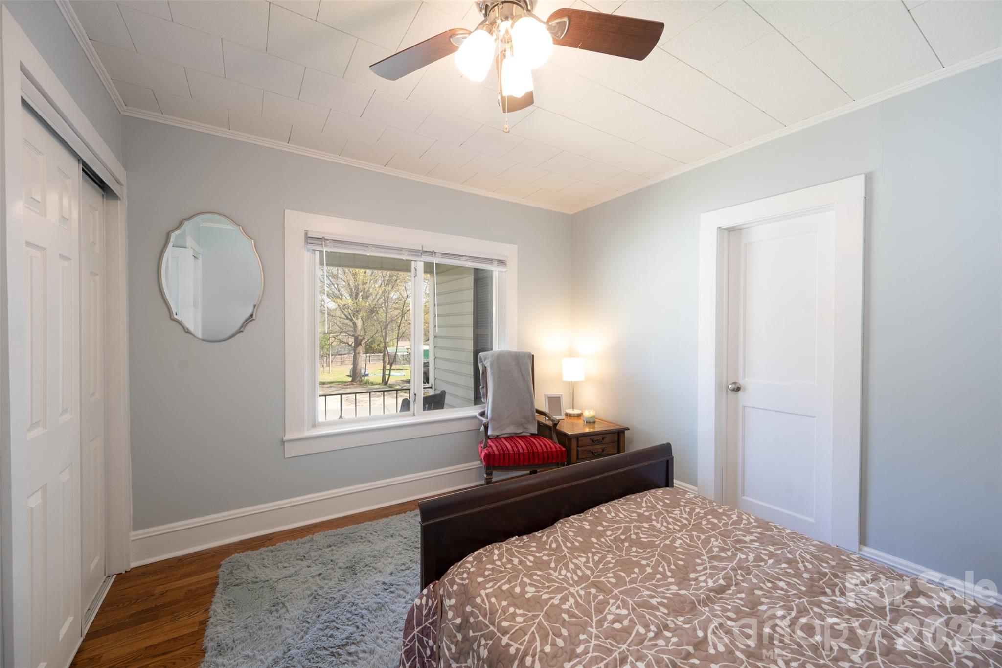 206 Bates Avenue Cherryville, NC 28021 - Photo 15 of 38 a bedroom with bed window and mirror