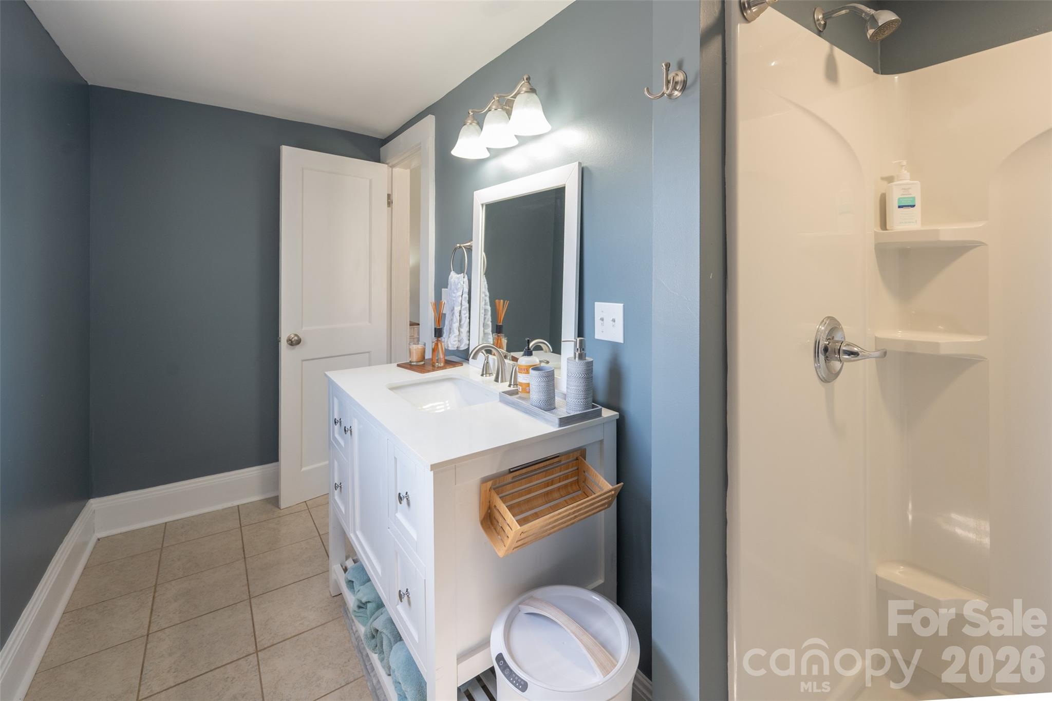 206 Bates Avenue Cherryville, NC 28021 - Photo 18 of 38 a bathroom with a sink a toilet and shower
