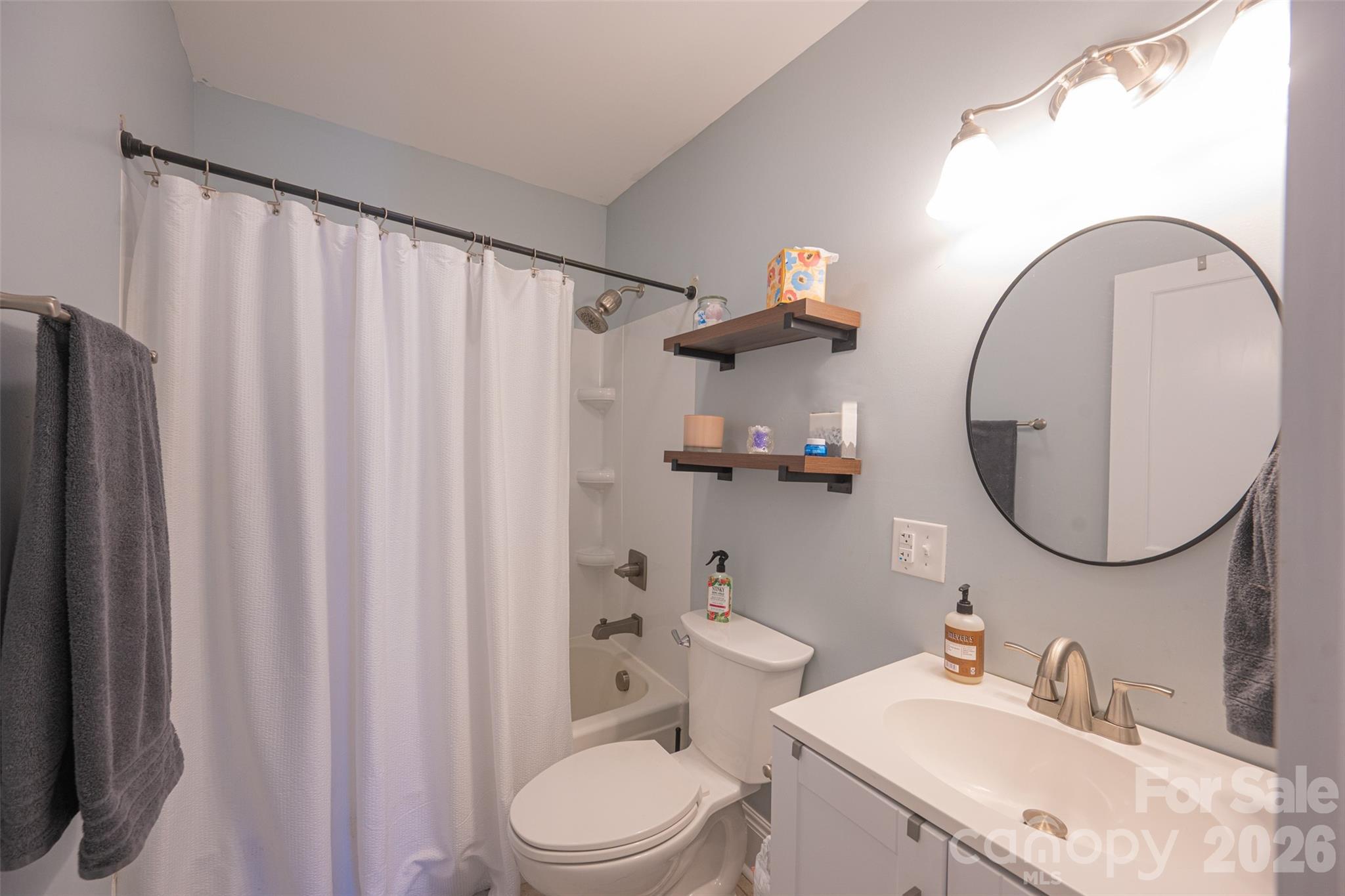 206 Bates Avenue Cherryville, NC 28021 - Photo 20 of 38 a bathroom with a sink a toilet and a mirror