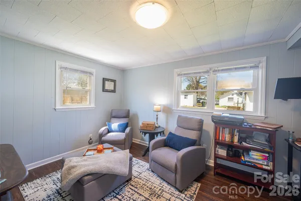 a room with furniture and a flat screen tv