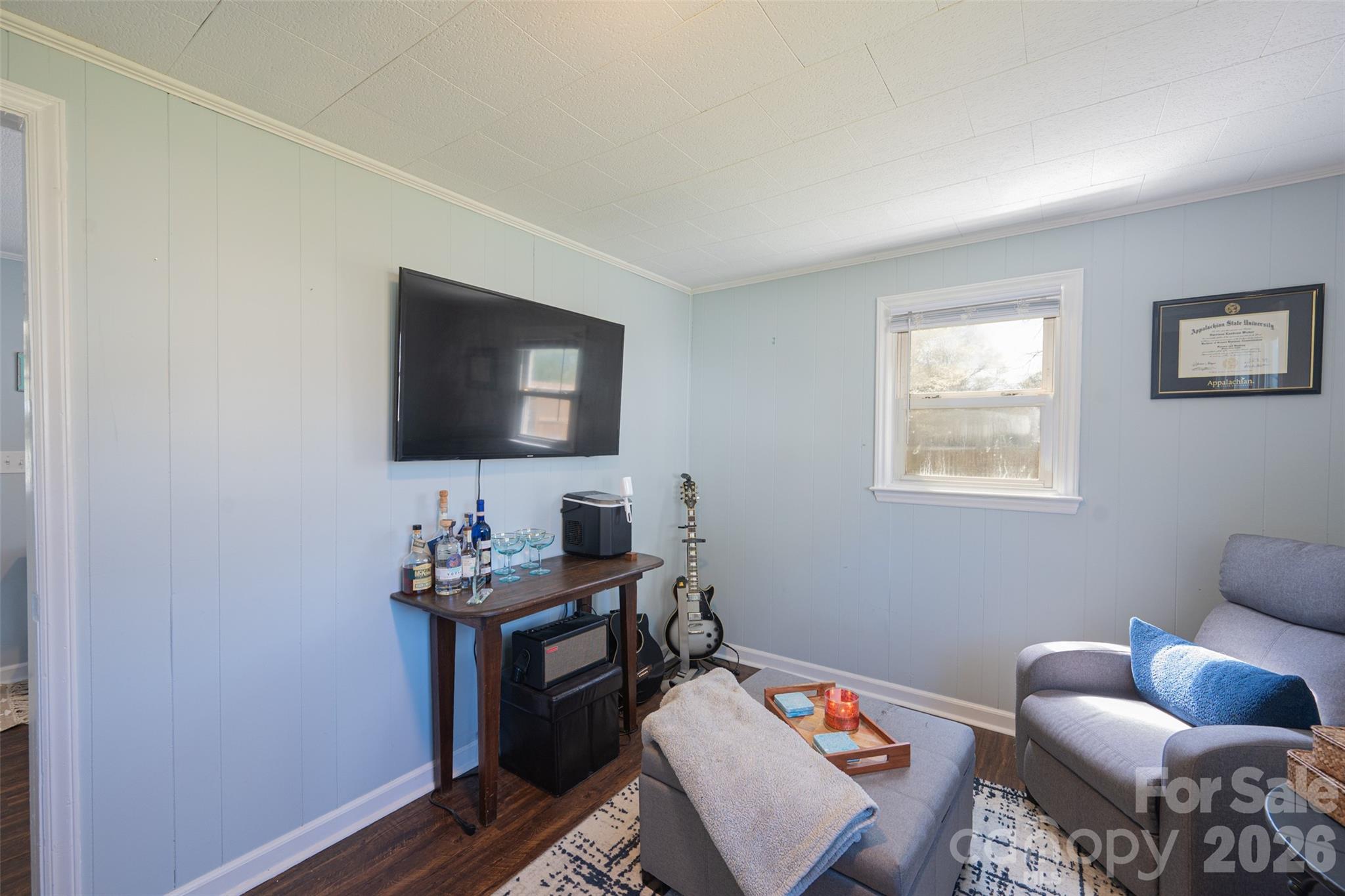 206 Bates Avenue Cherryville, NC 28021 - Photo 29 of 38 a room with furniture and a flat screen tv