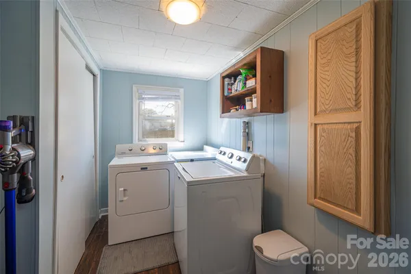 a view of a porch with furniture and a yard
