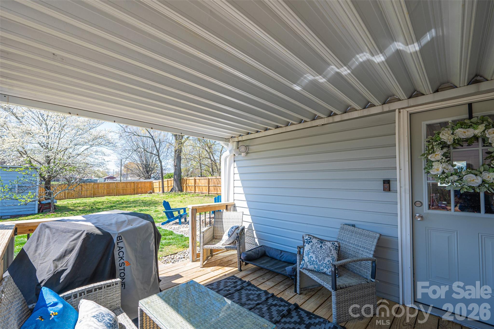 206 Bates Avenue Cherryville, NC 28021 - Photo 32 of 38 a view of a porch with furniture and a yard