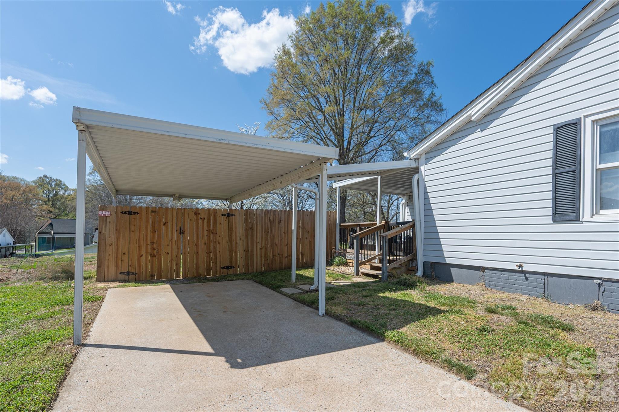 206 Bates Avenue Cherryville, NC 28021 - Photo 33 of 38 a front view of a house with garden