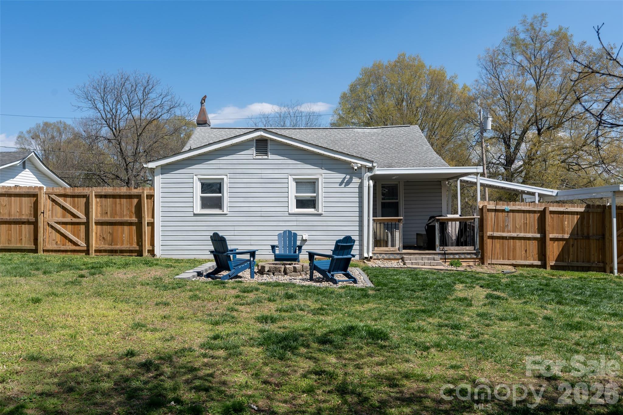 206 Bates Avenue Cherryville, NC 28021 - Photo 37 of 38 a backyard of a house with table and chairs