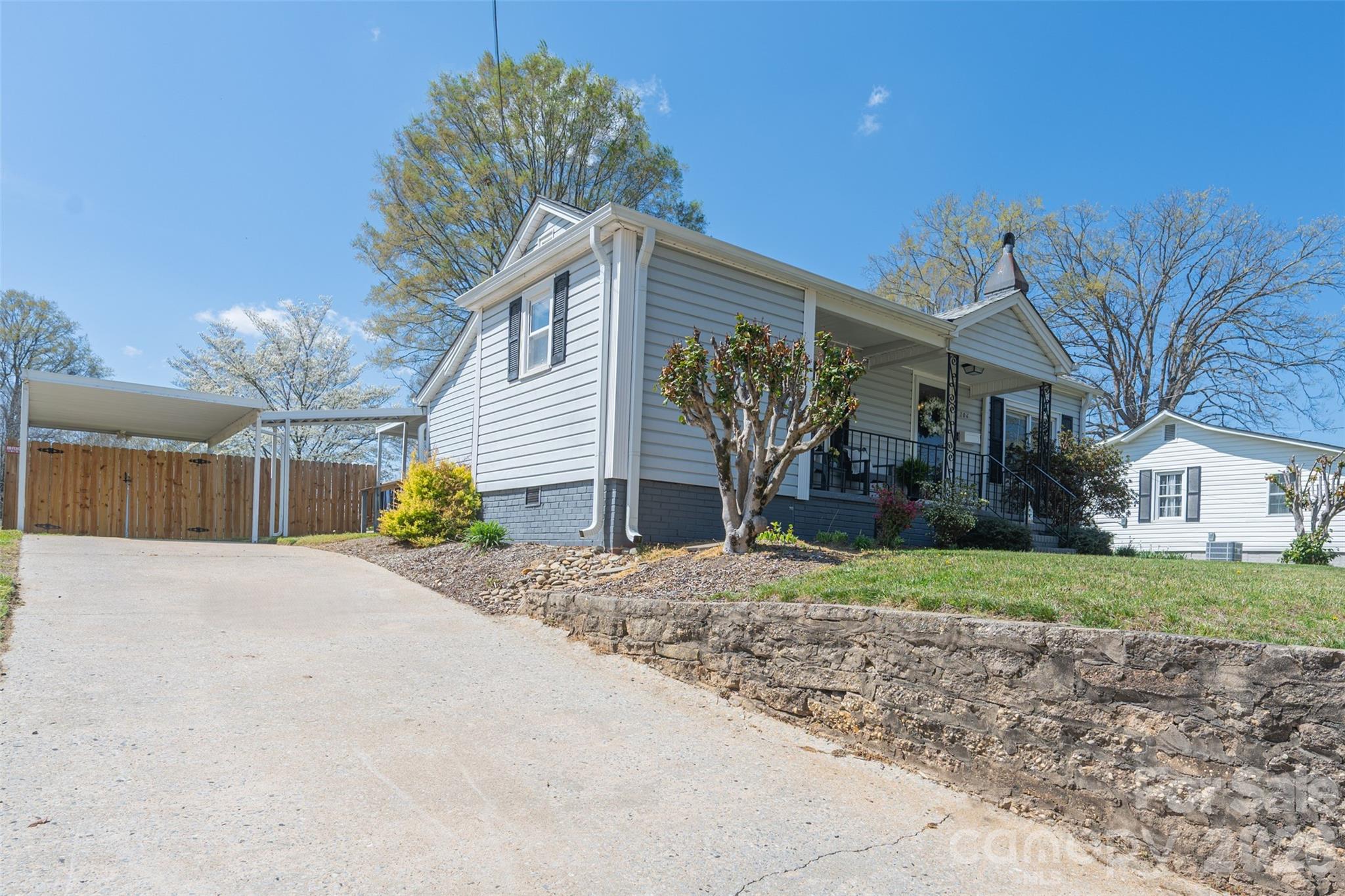 206 Bates Avenue Cherryville, NC 28021 - Photo 4 of 38 a front view of a house with a yard and garage