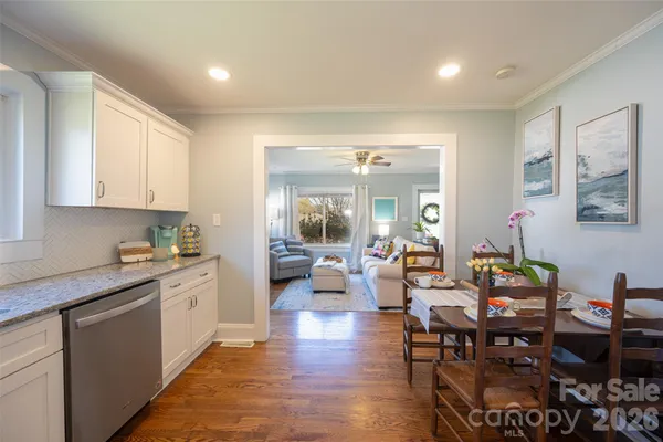 a large kitchen with kitchen island granite countertop lots of counter top space and stainless steel appliances