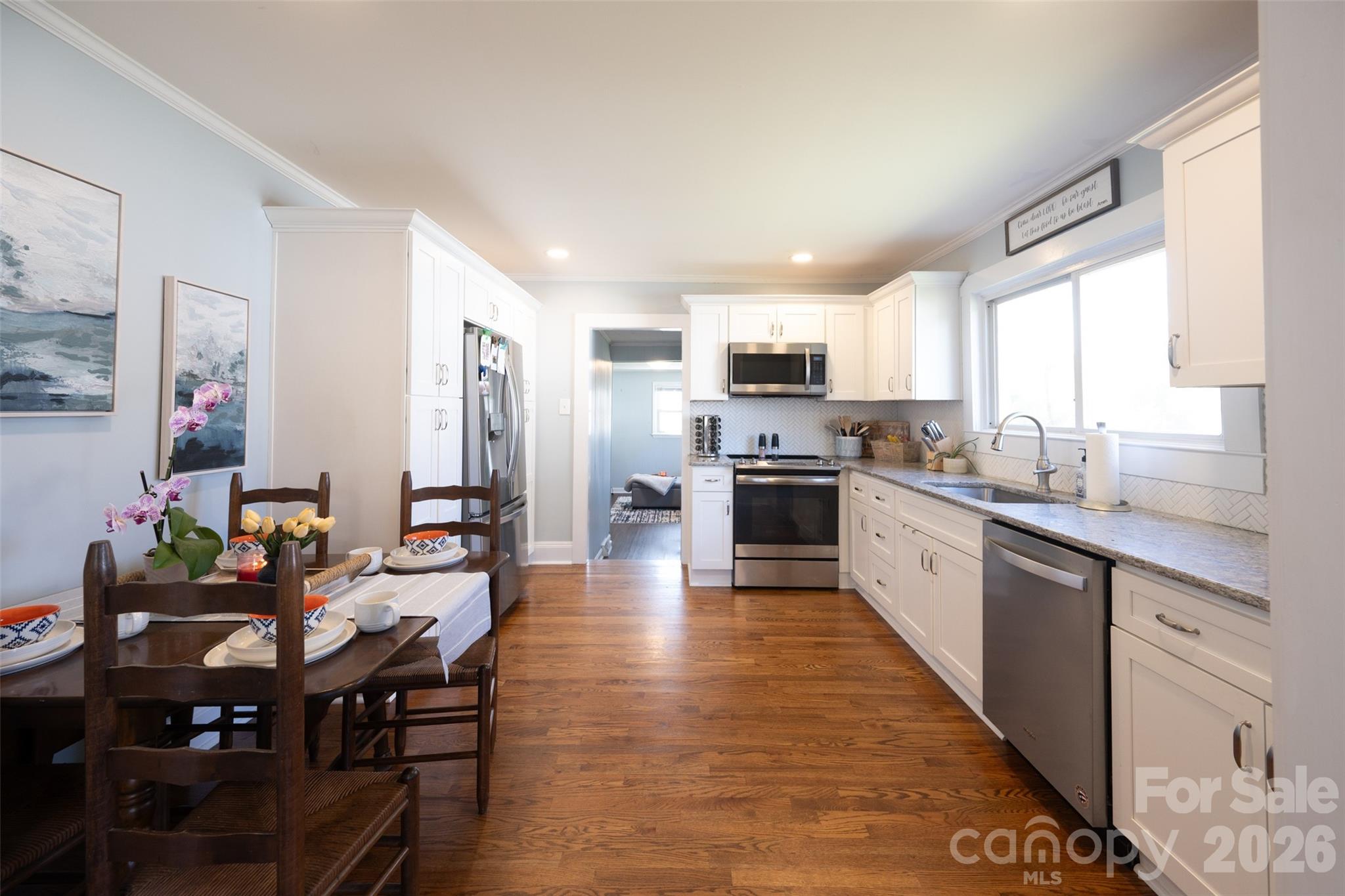 206 Bates Avenue Cherryville, NC 28021 - Photo 9 of 38 a large kitchen with kitchen island granite countertop lots of counter top space and stainless steel appliances