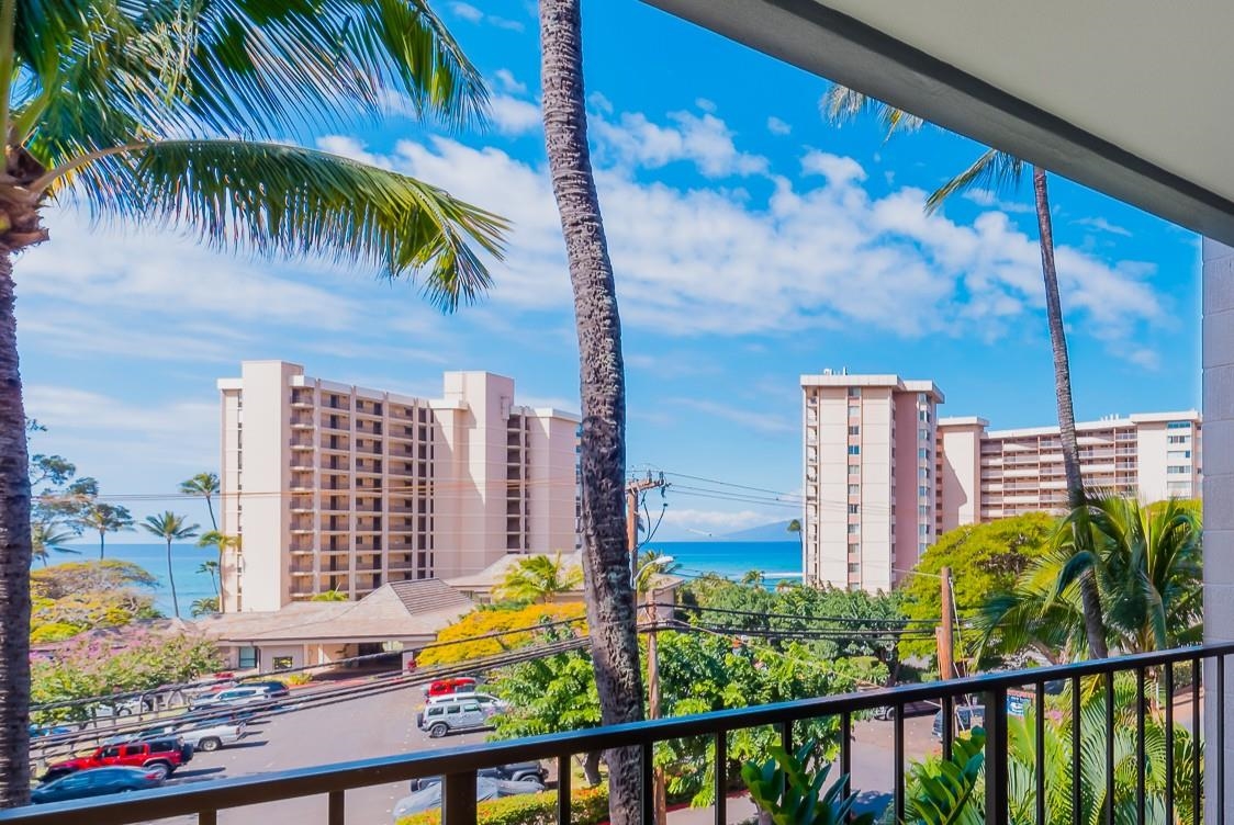 4310 Lower Honoapiilani Road, Unit 302 Lahaina, HI 96761 - Photo 1 of 50 a view of a city from a balcony