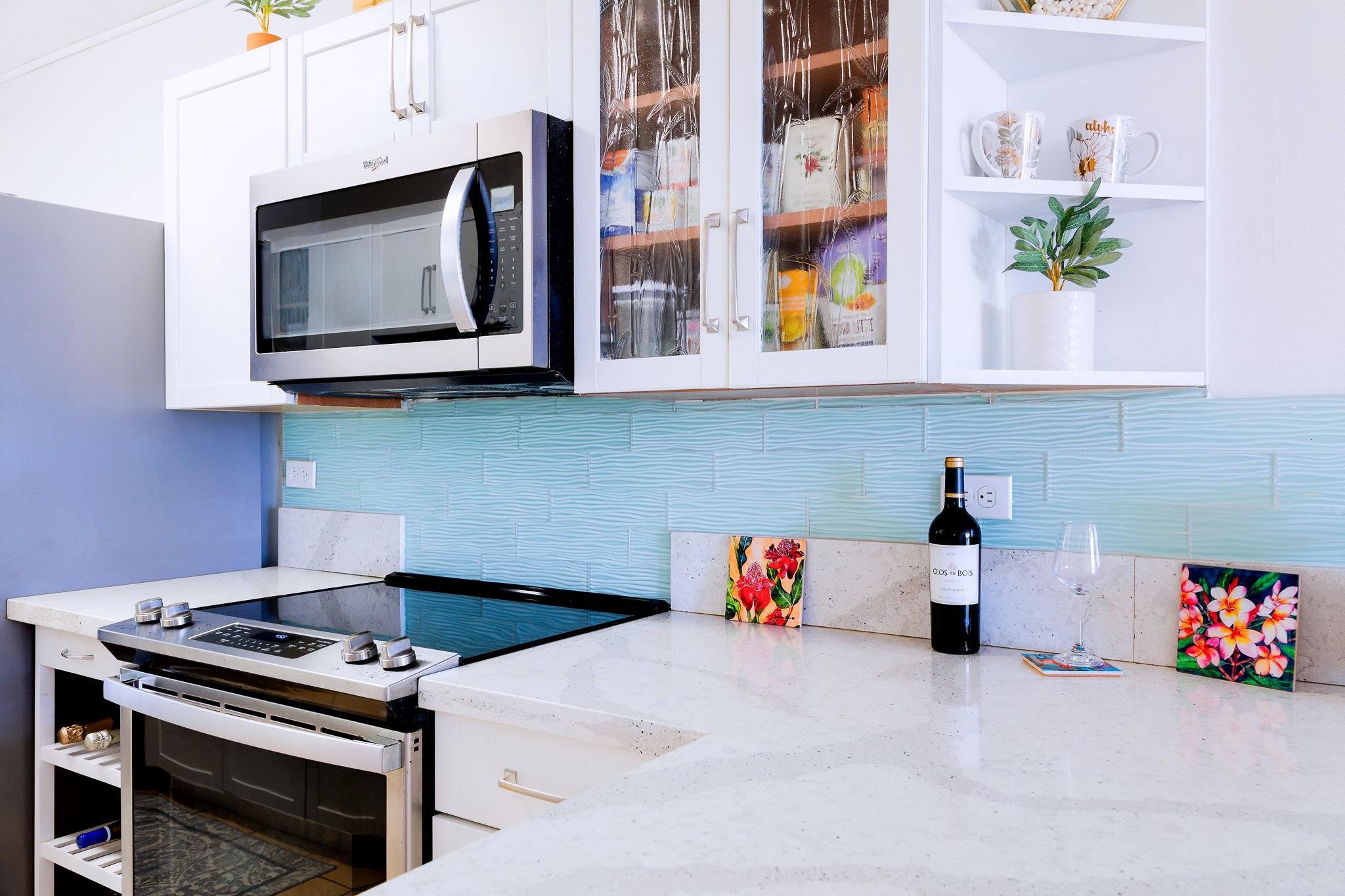 4310 Lower Honoapiilani Road, Unit 302 Lahaina, HI 96761 - Photo 15 of 50 a kitchen with a stove and a microwave