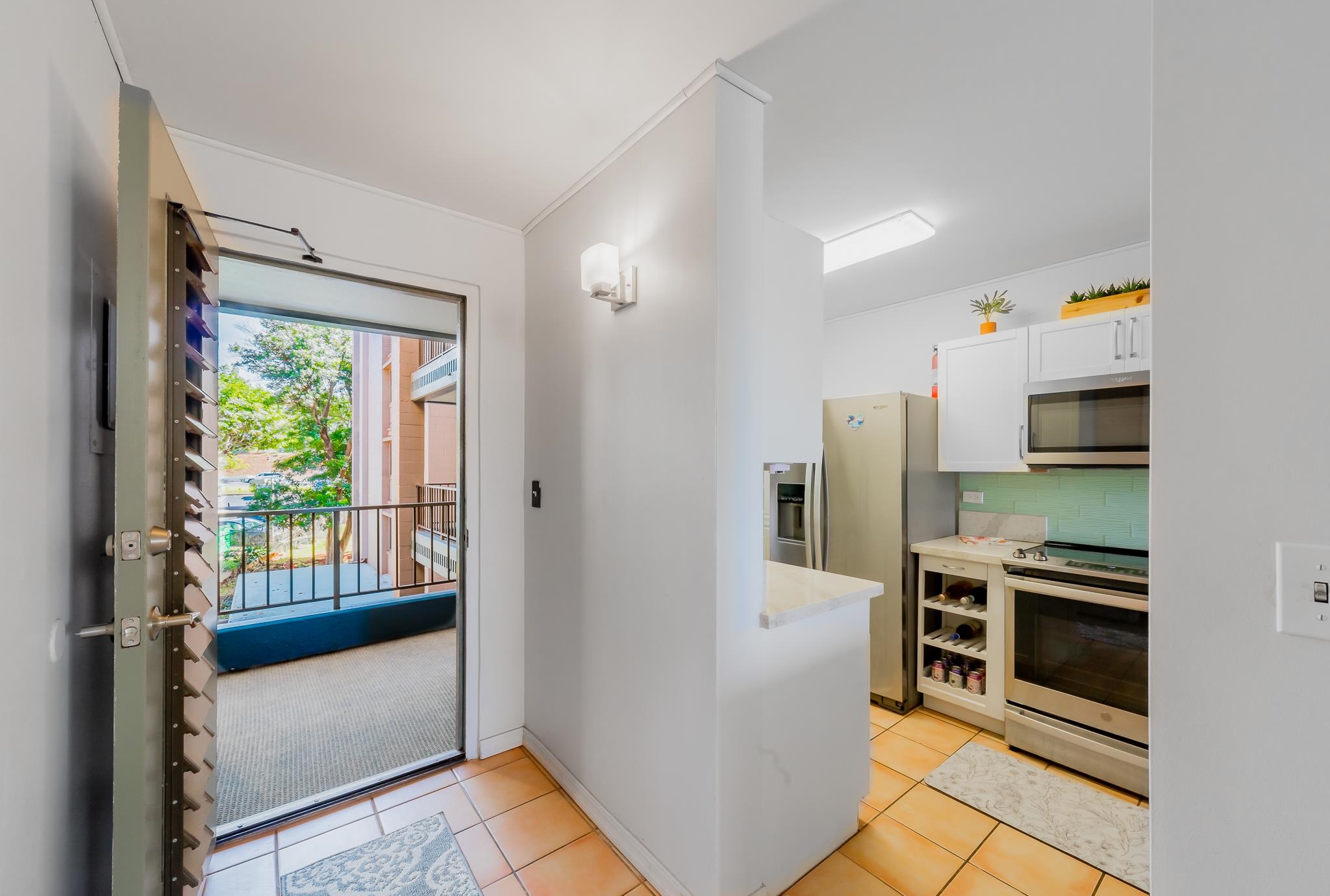 4310 Lower Honoapiilani Road, Unit 302 Lahaina, HI 96761 - Photo 21 of 50 a kitchen with stainless steel appliances a stove and a refrigerator