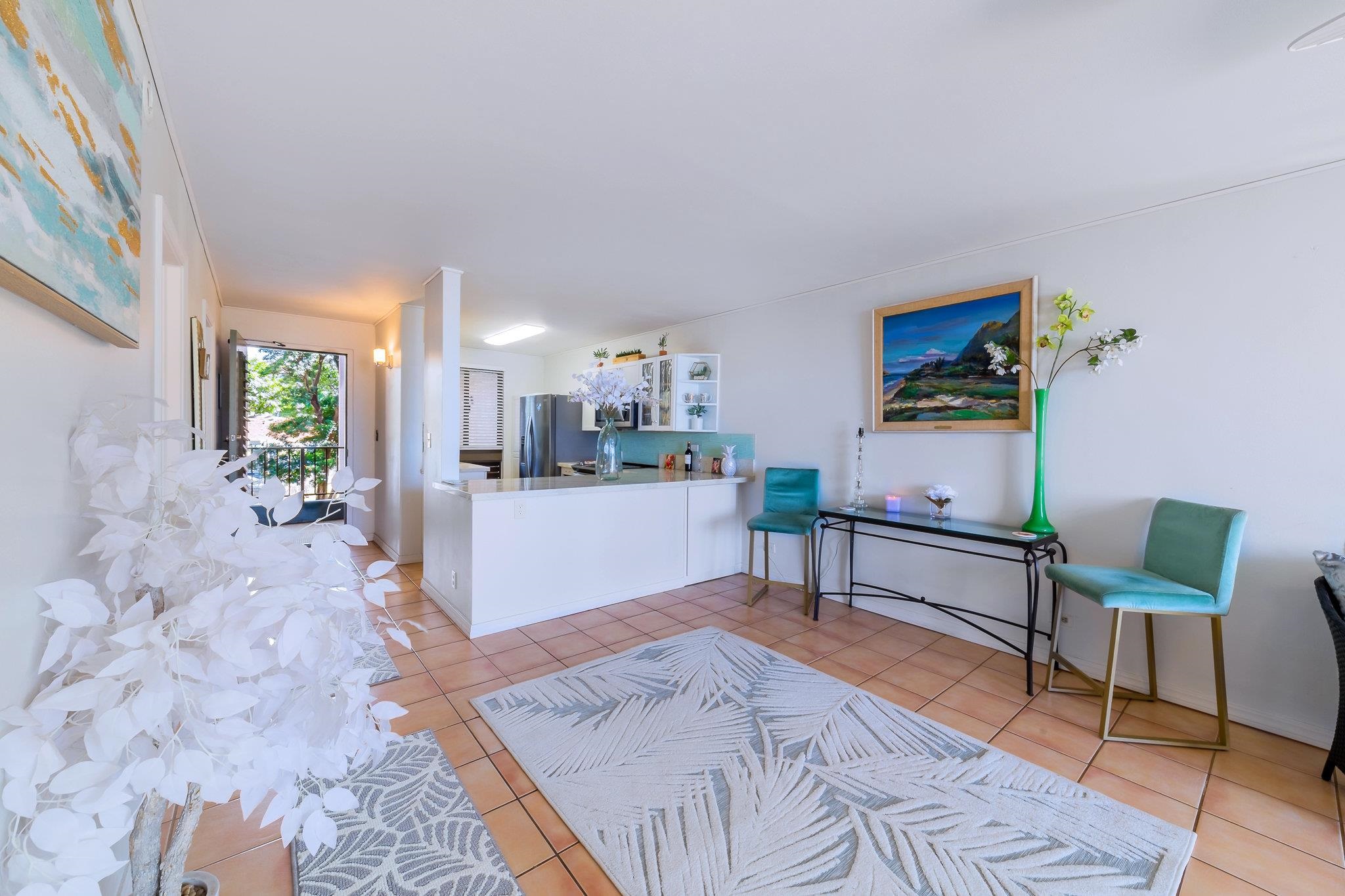 4310 Lower Honoapiilani Road, Unit 302 Lahaina, HI 96761 - Photo 7 of 50 a living room with furniture and a table