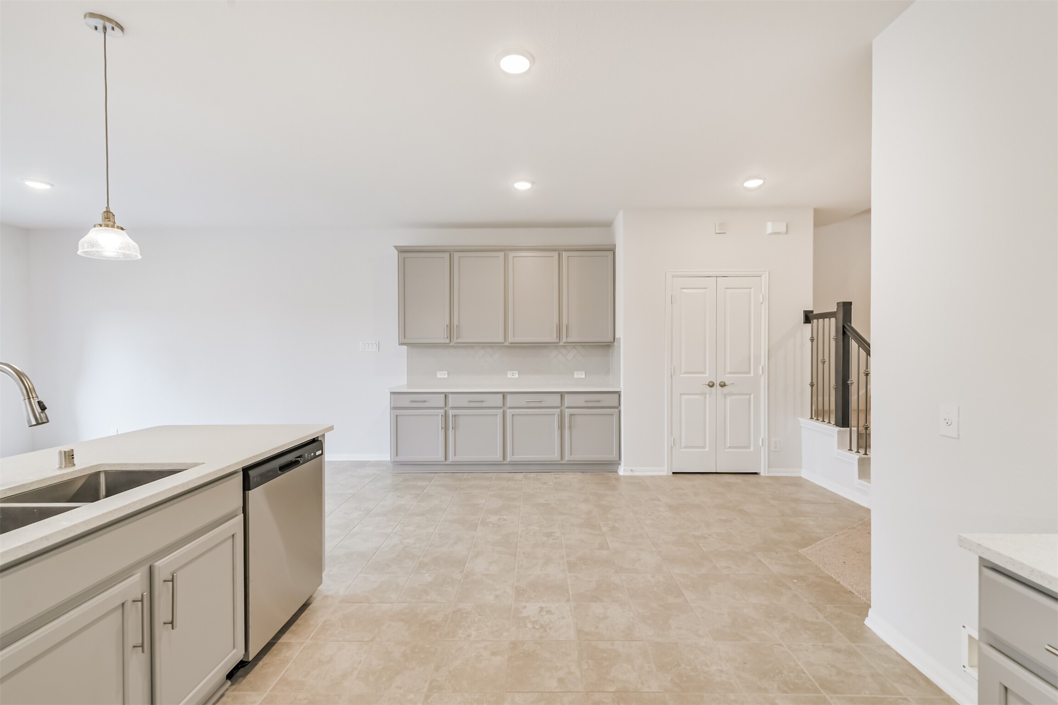 2129 Solstice Boulevard Spring, TX 77386 - Photo 12 of 49 Open dining area with extended cabinetry for extra storage and serving space. Neutral tile flooring, soft natural light, and an easy flow from the kitchen to the living areas make this space both practical and inviting.