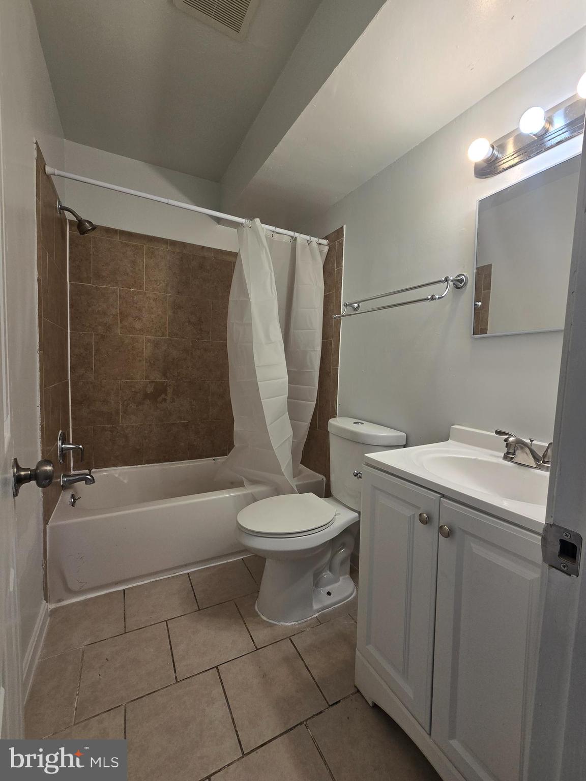 520 56th Street Northeast Washington, DC 20019 - Photo 4 of 15 a bathroom with a sink a toilet and shower