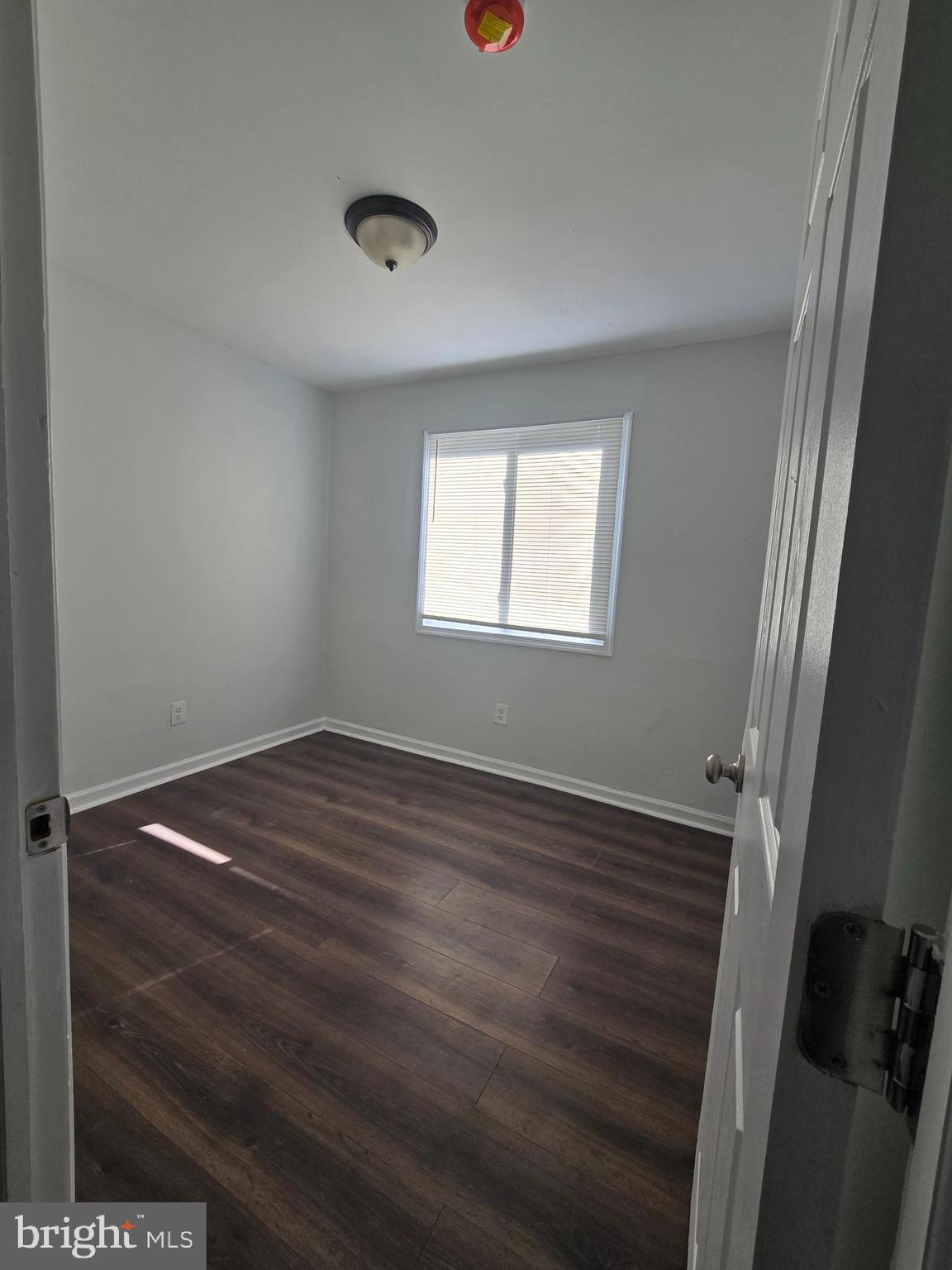 520 56th Street Northeast Washington, DC 20019 - Photo 8 of 15 a view of empty room with window and hardwood floor