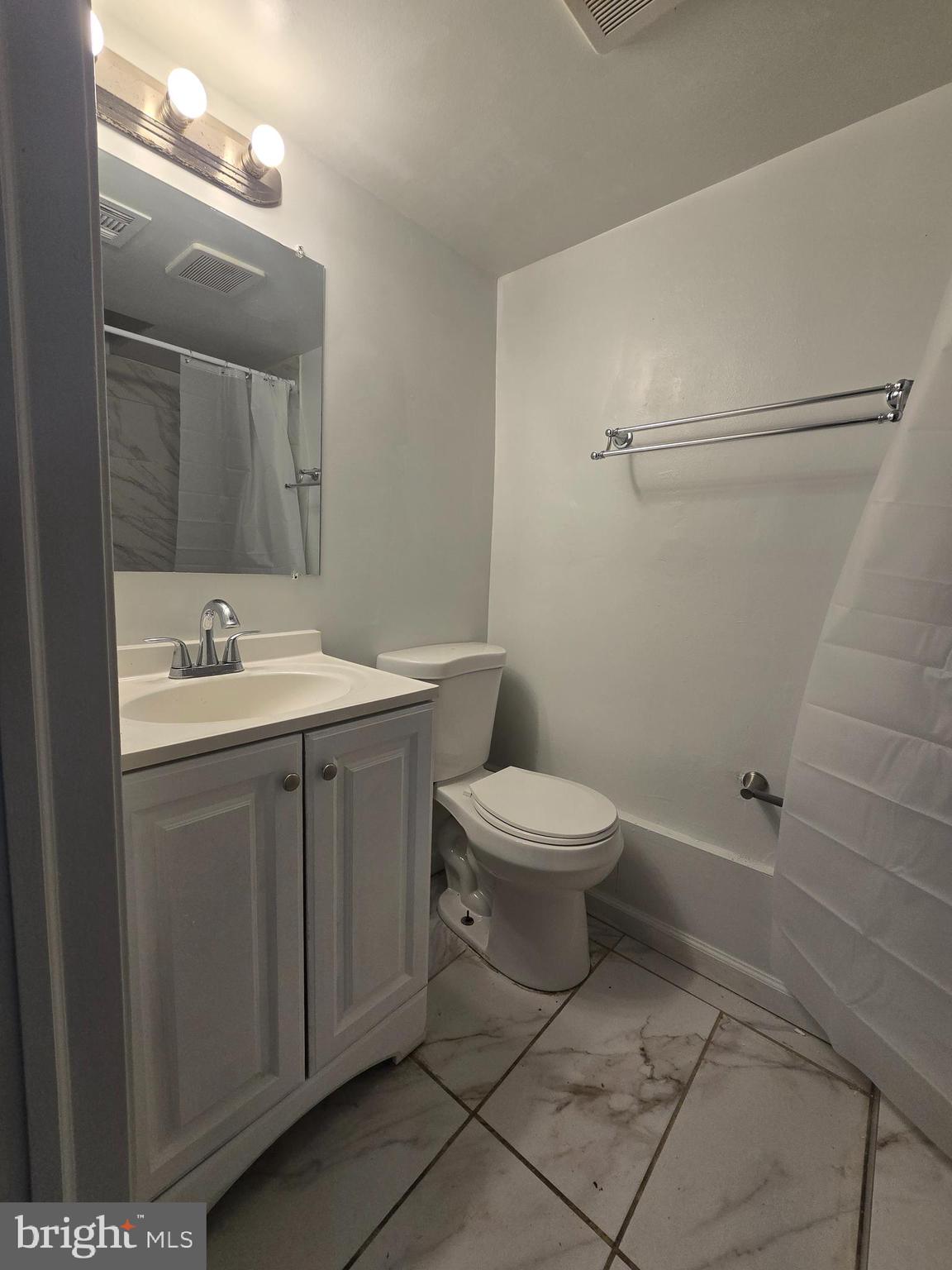 520 56th Street Northeast Washington, DC 20019 - Photo 10 of 15 a bathroom with a toilet sink and mirror