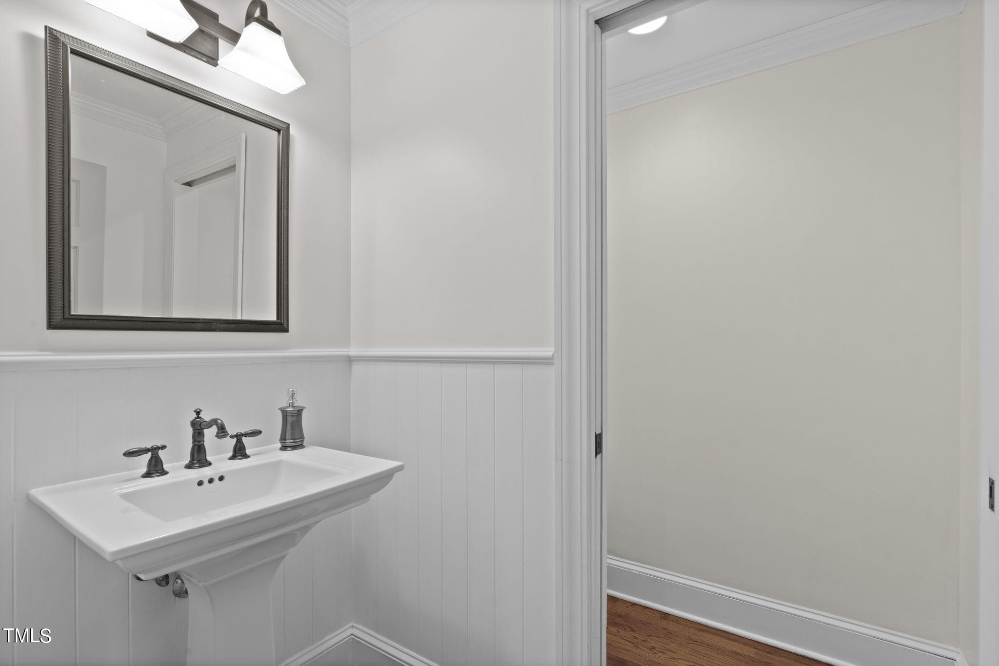 3919 Regent Road Durham, NC 27707 - Photo 14 of 87 a bathroom with a sink a mirror and vanity