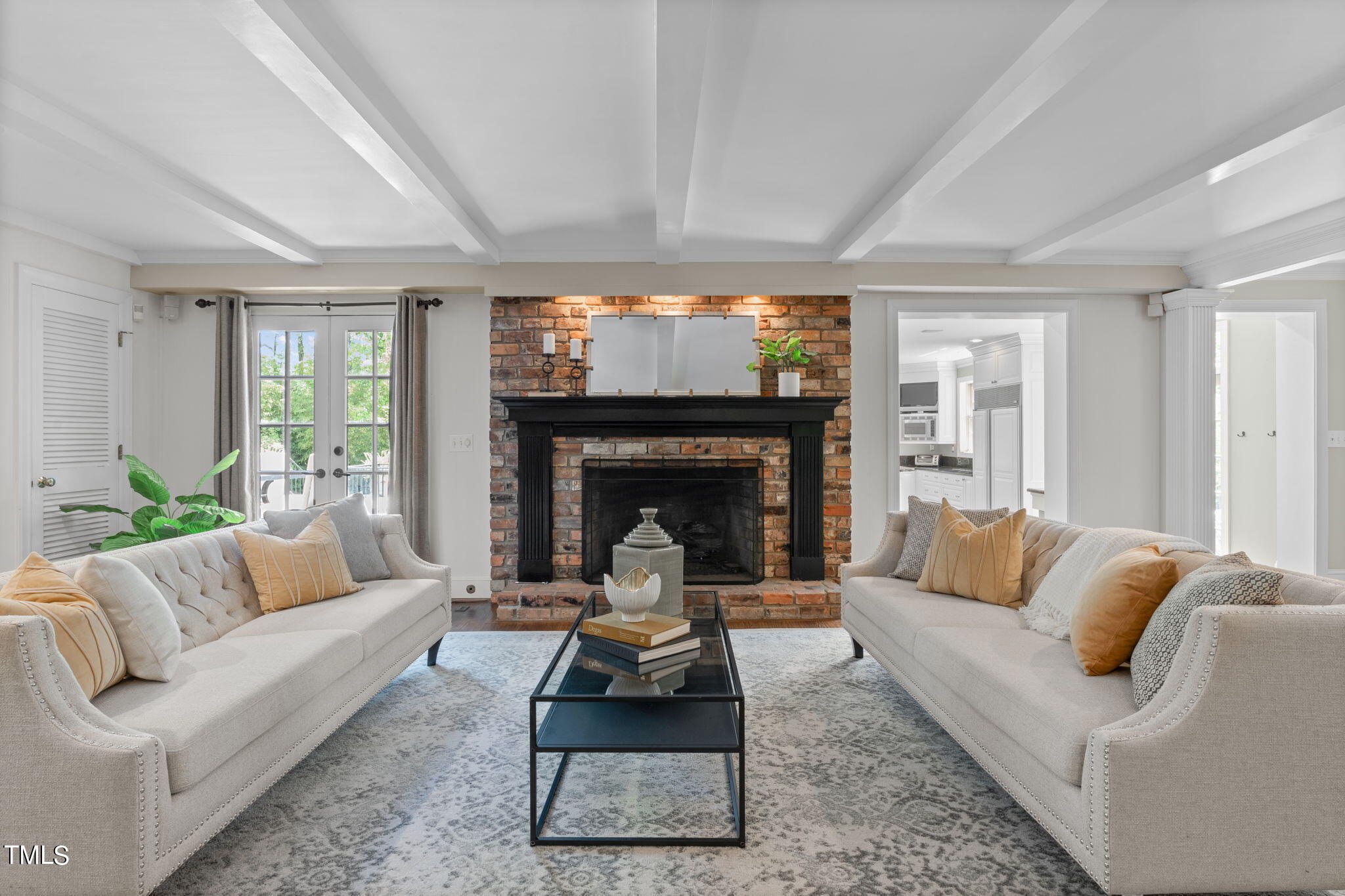 3919 Regent Road Durham, NC 27707 - Photo 17 of 87 a living room with furniture a rug a fireplace and a large window