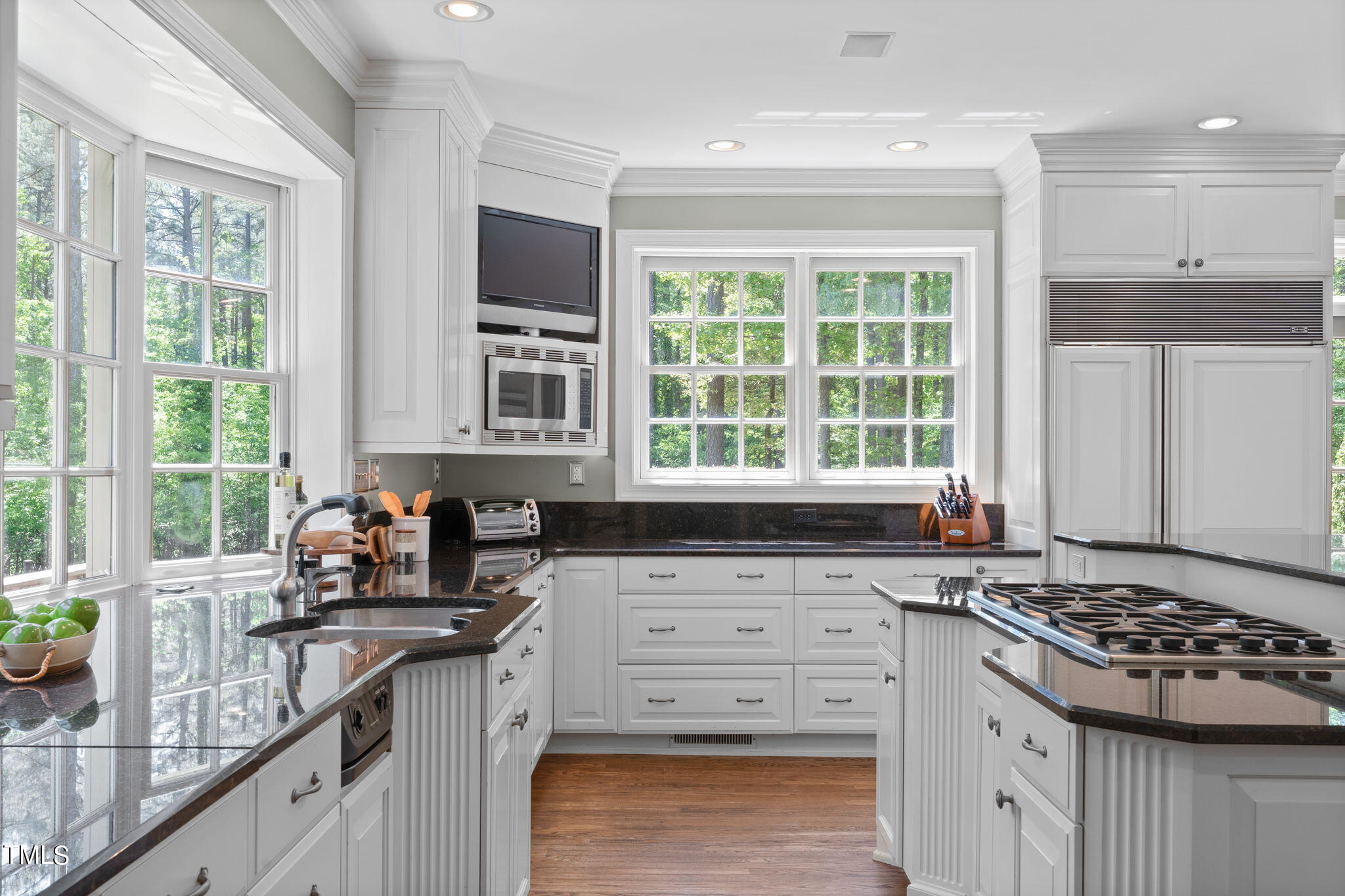 3919 Regent Road Durham, NC 27707 - Photo 23 of 87 a kitchen with granite countertop a sink stove and cabinets