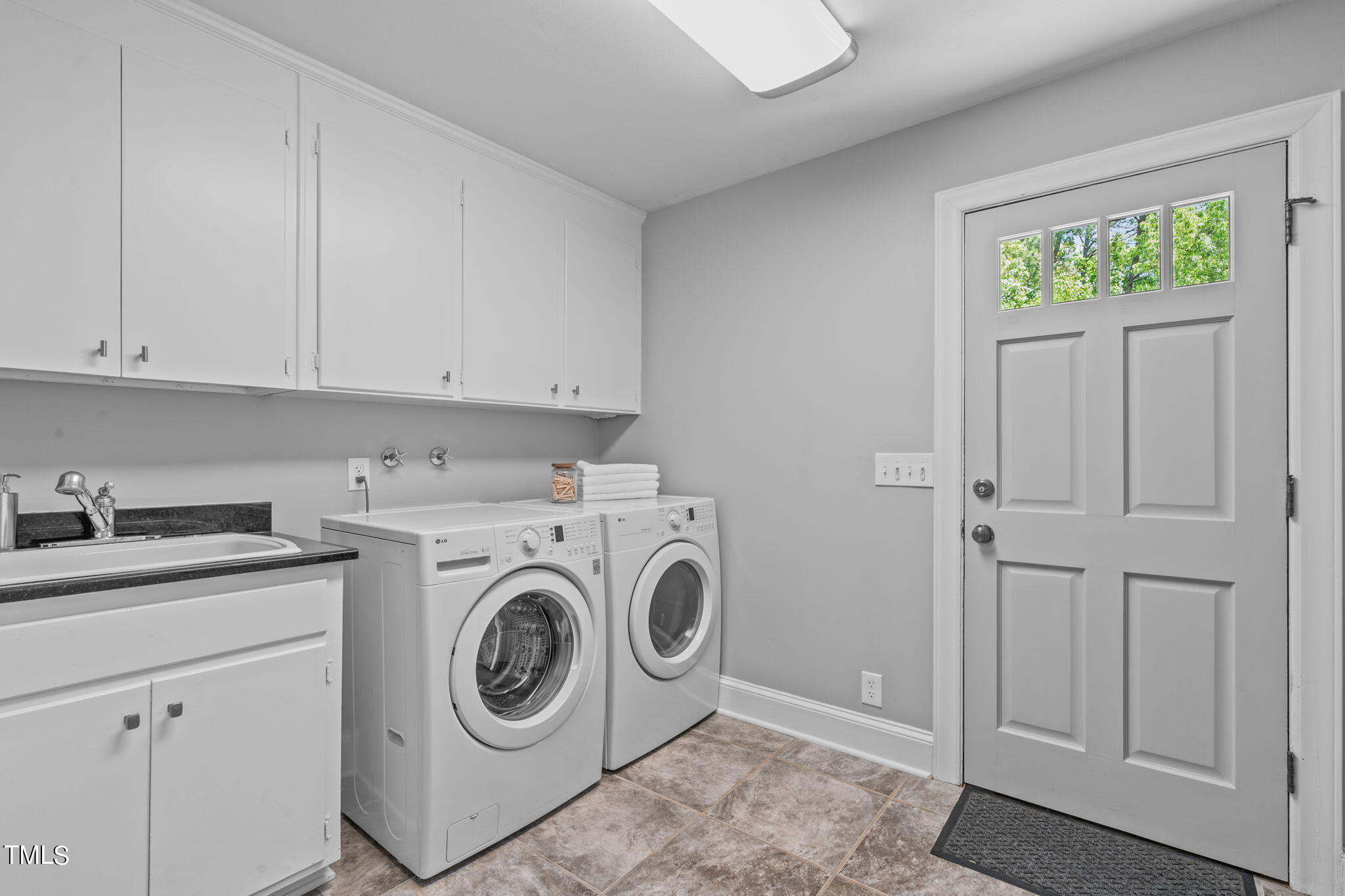 3919 Regent Road Durham, NC 27707 - Photo 30 of 87 a utility room with sink dryer and washer