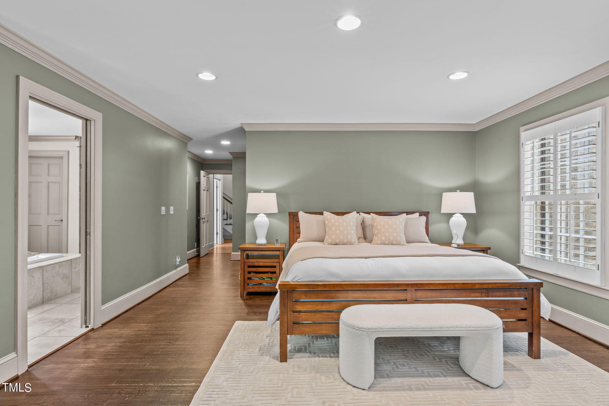 3919 Regent Road Durham, NC 27707 - Photo 34 of 87 a bedroom with a bed and wooden floor