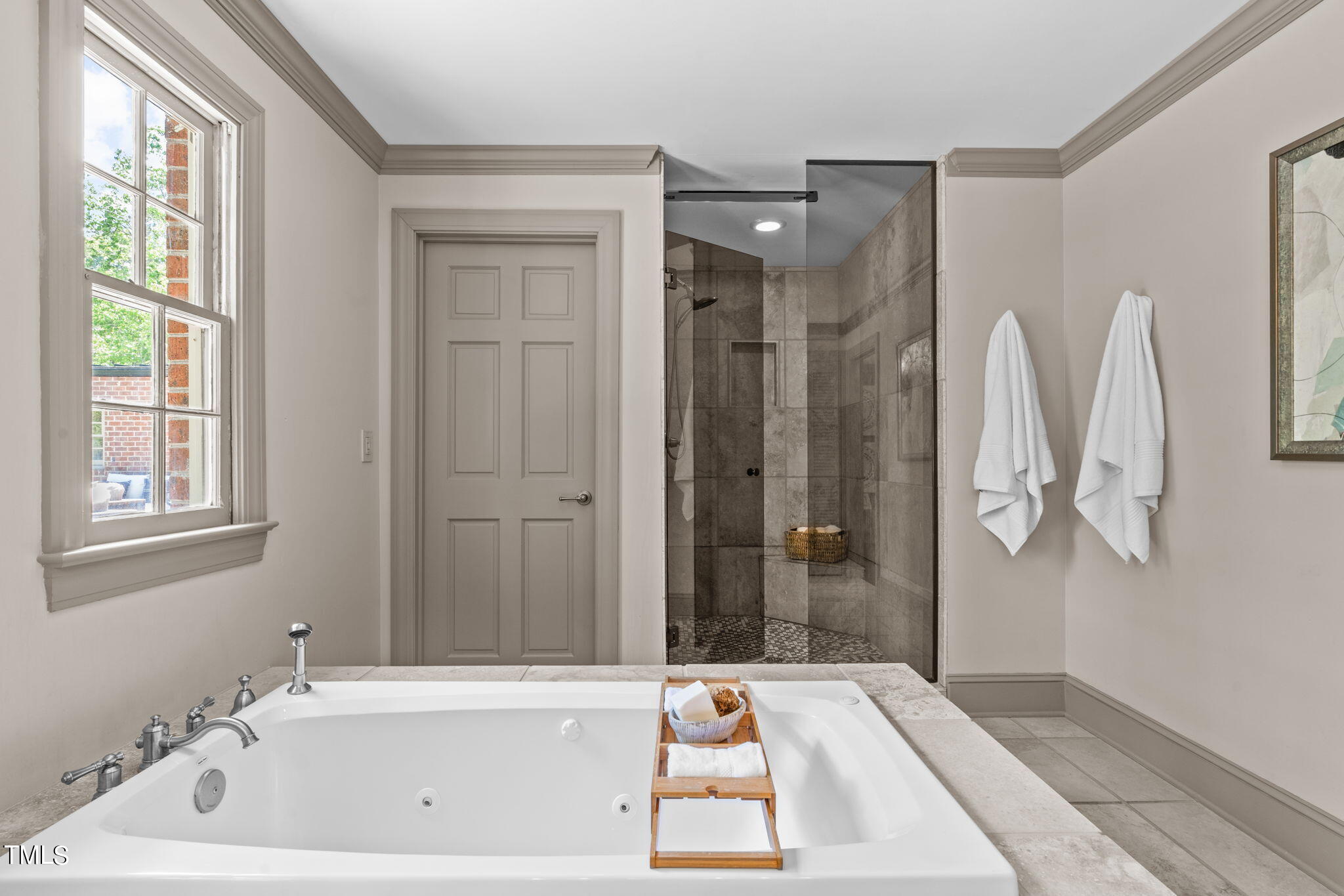 3919 Regent Road Durham, NC 27707 - Photo 39 of 87 a bathroom with a tub shower and sink