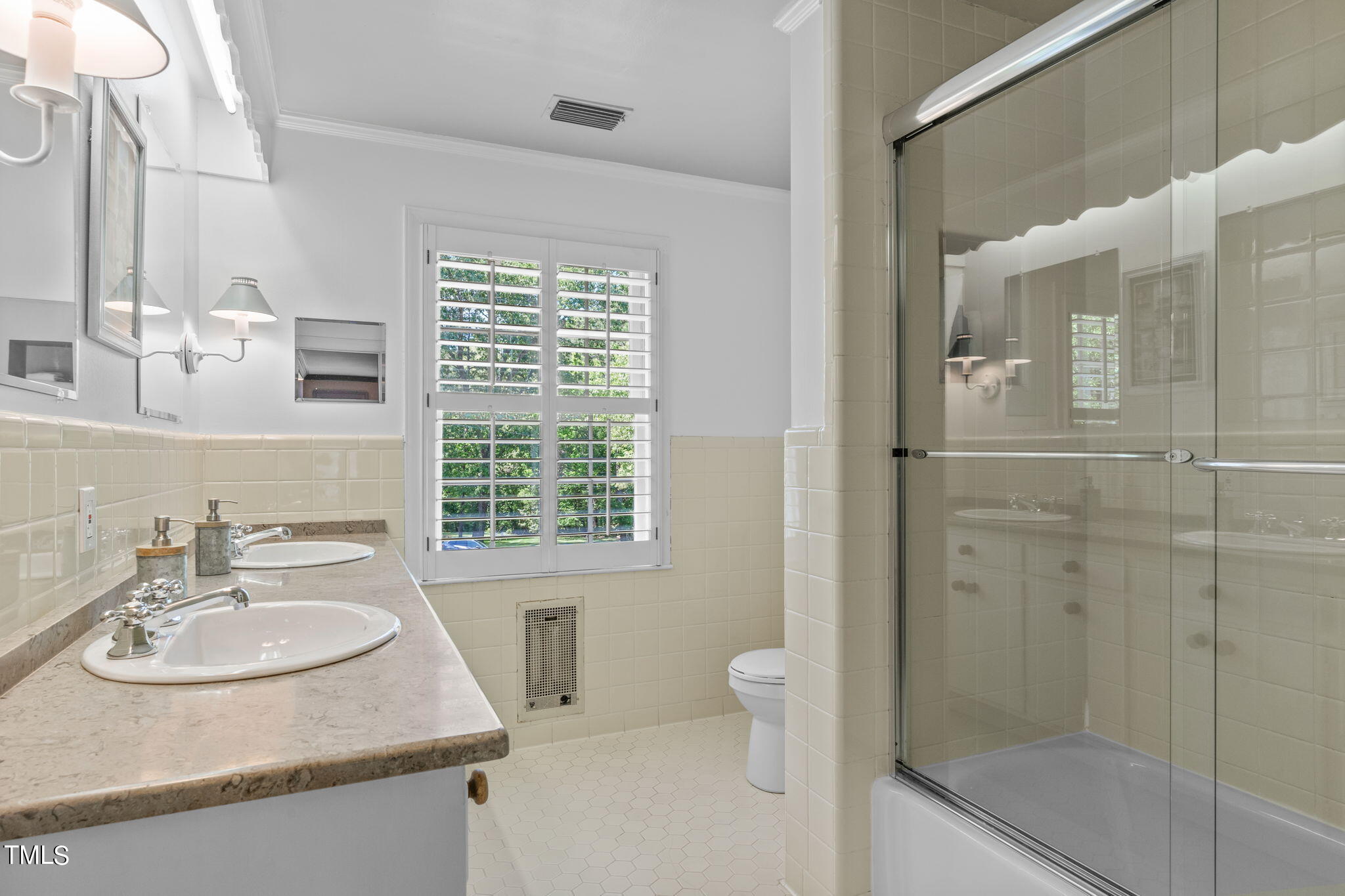 3919 Regent Road Durham, NC 27707 - Photo 52 of 87 a bathroom with a sink toilet a shower and a mirror
