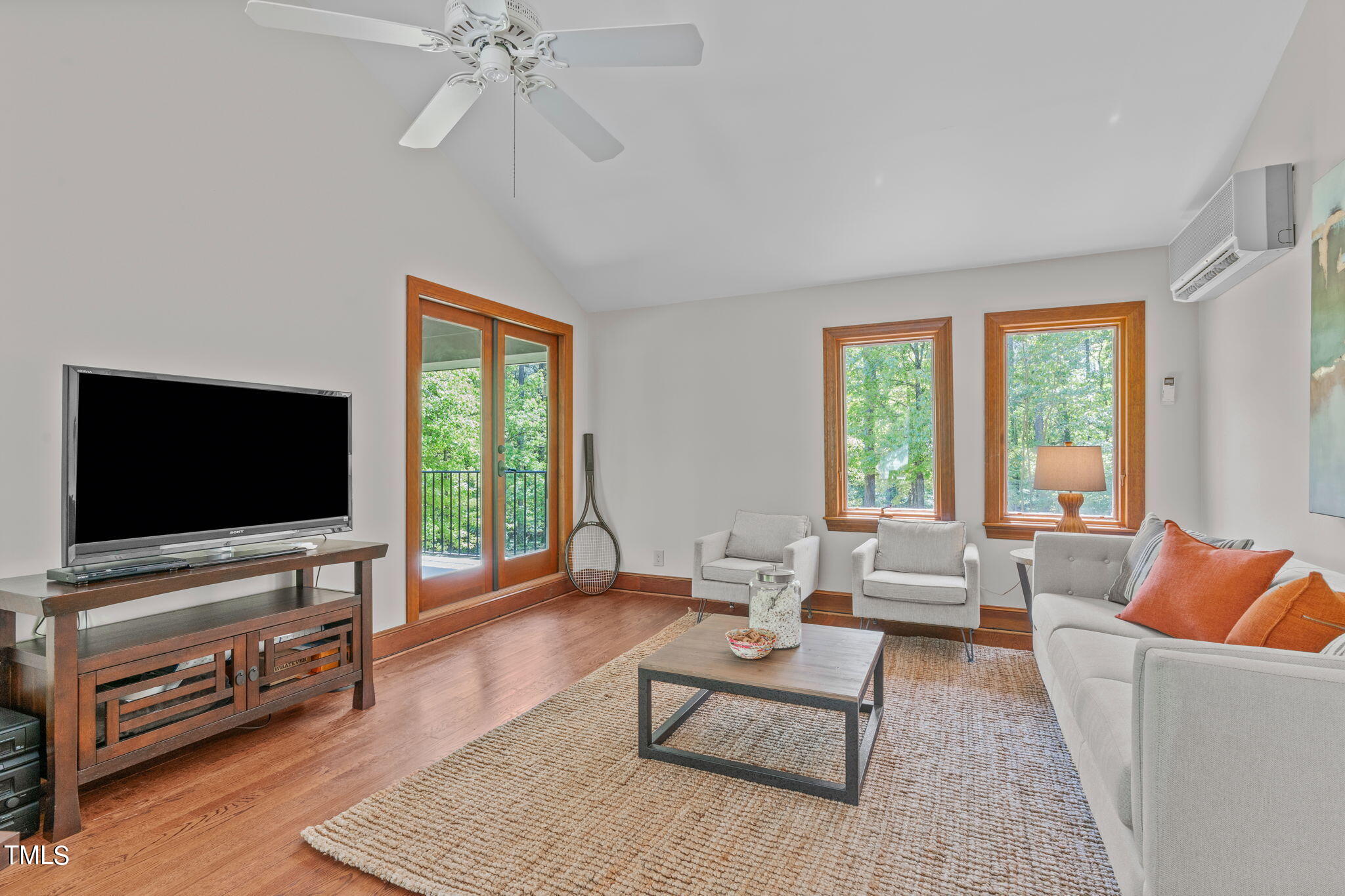 3919 Regent Road Durham, NC 27707 - Photo 61 of 87 a living room with furniture and a flat screen tv