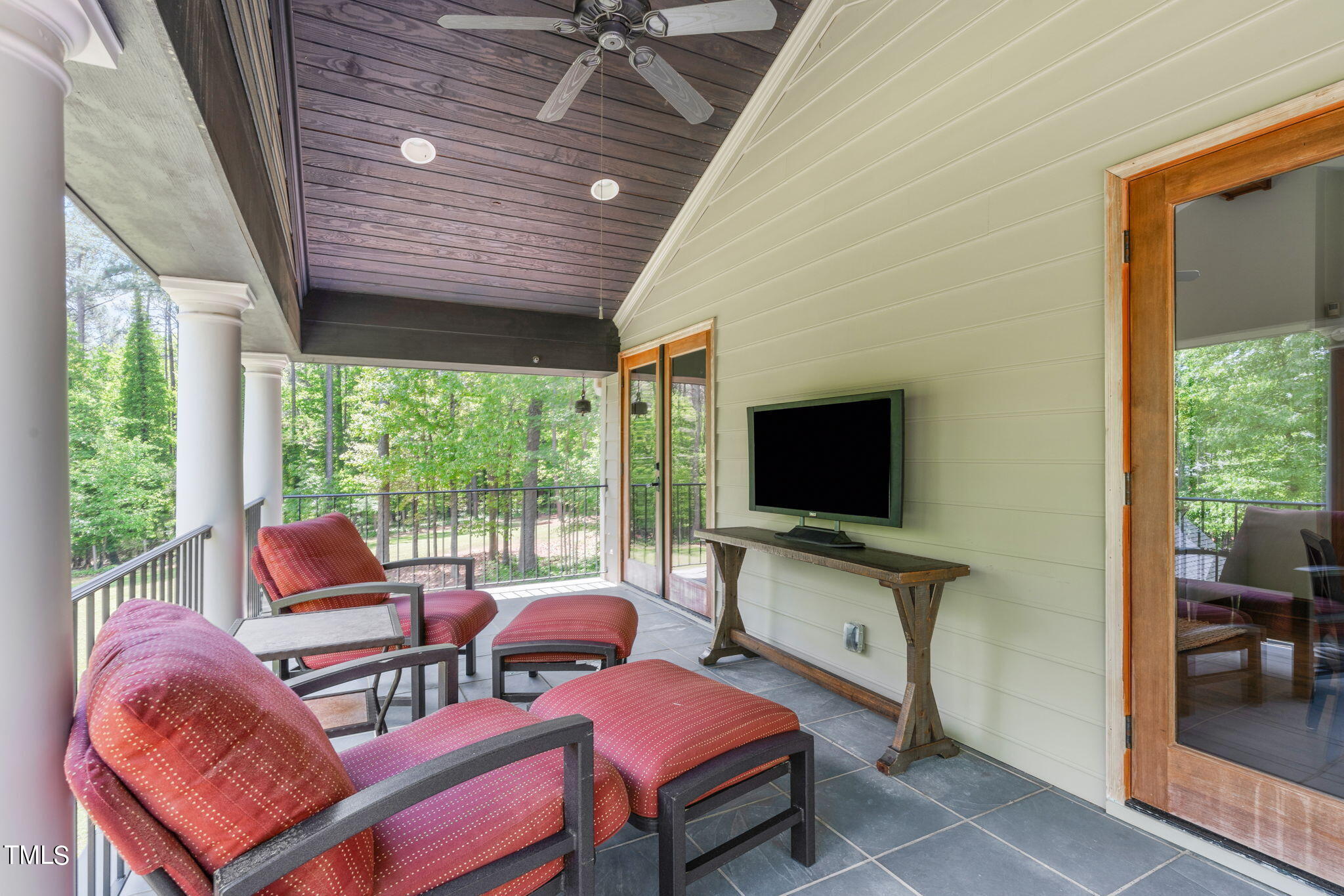 3919 Regent Road Durham, NC 27707 - Photo 63 of 87 a outdoor living space with furniture and a flat screen tv