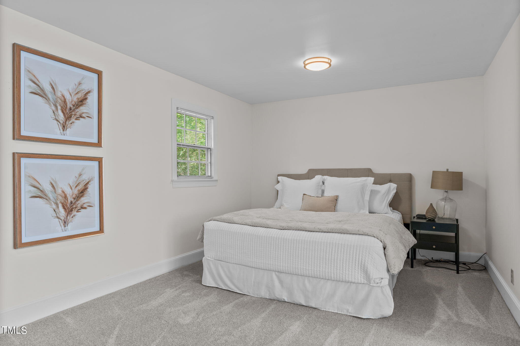 3919 Regent Road Durham, NC 27707 - Photo 67 of 87 a bedroom with a bed and a painting on the wall