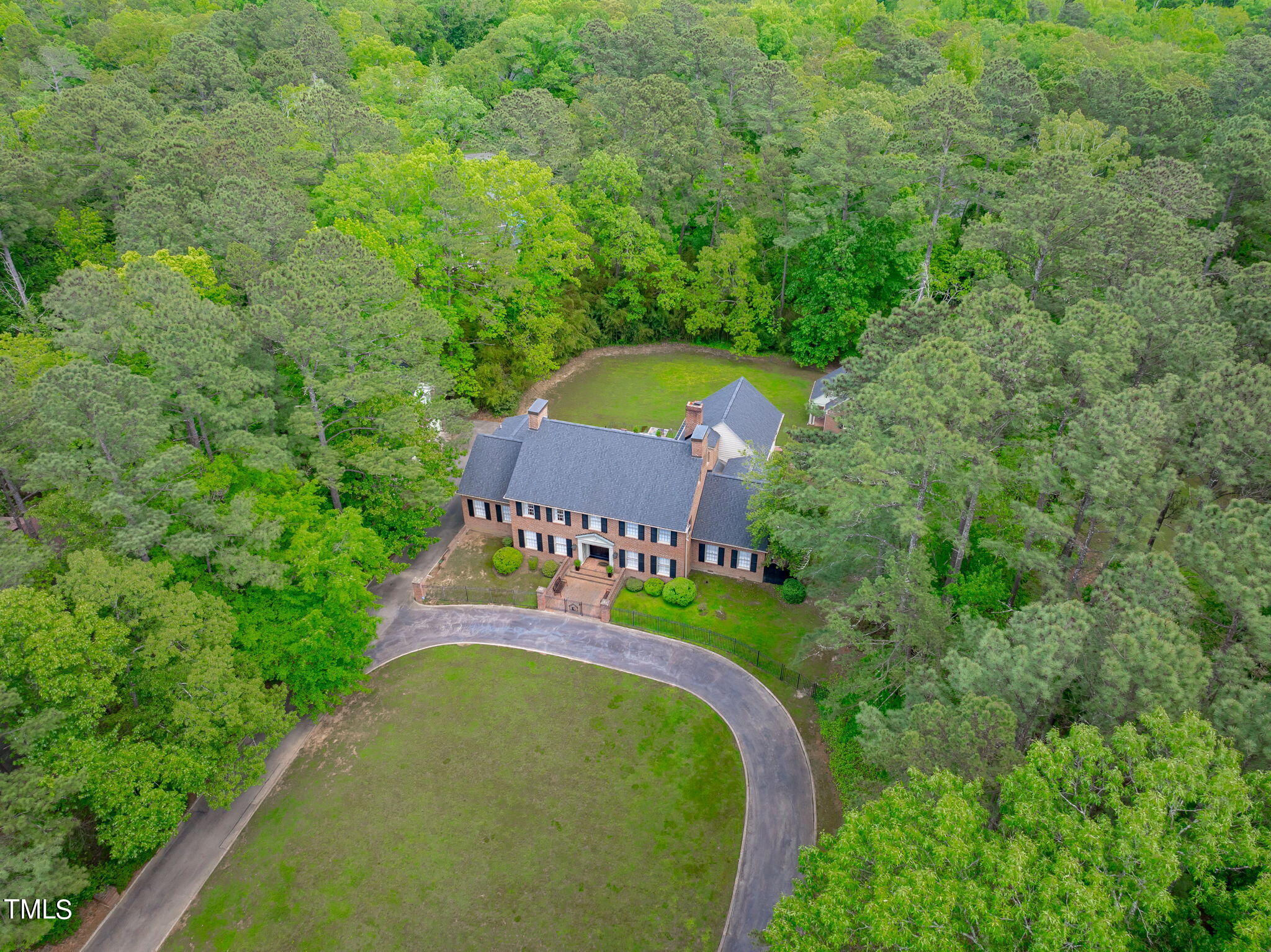 3919 Regent Road Durham, NC 27707 - Photo 82 of 87 an aerial view of a house with a yard and trees all around