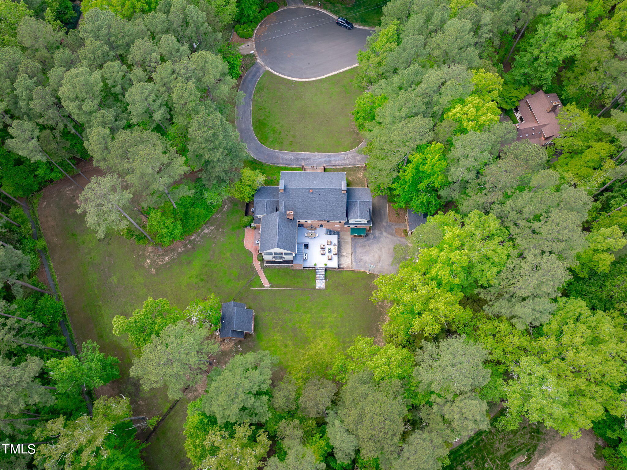 3919 Regent Road Durham, NC 27707 - Photo 84 of 87 an aerial view of a house with a garden and lake view