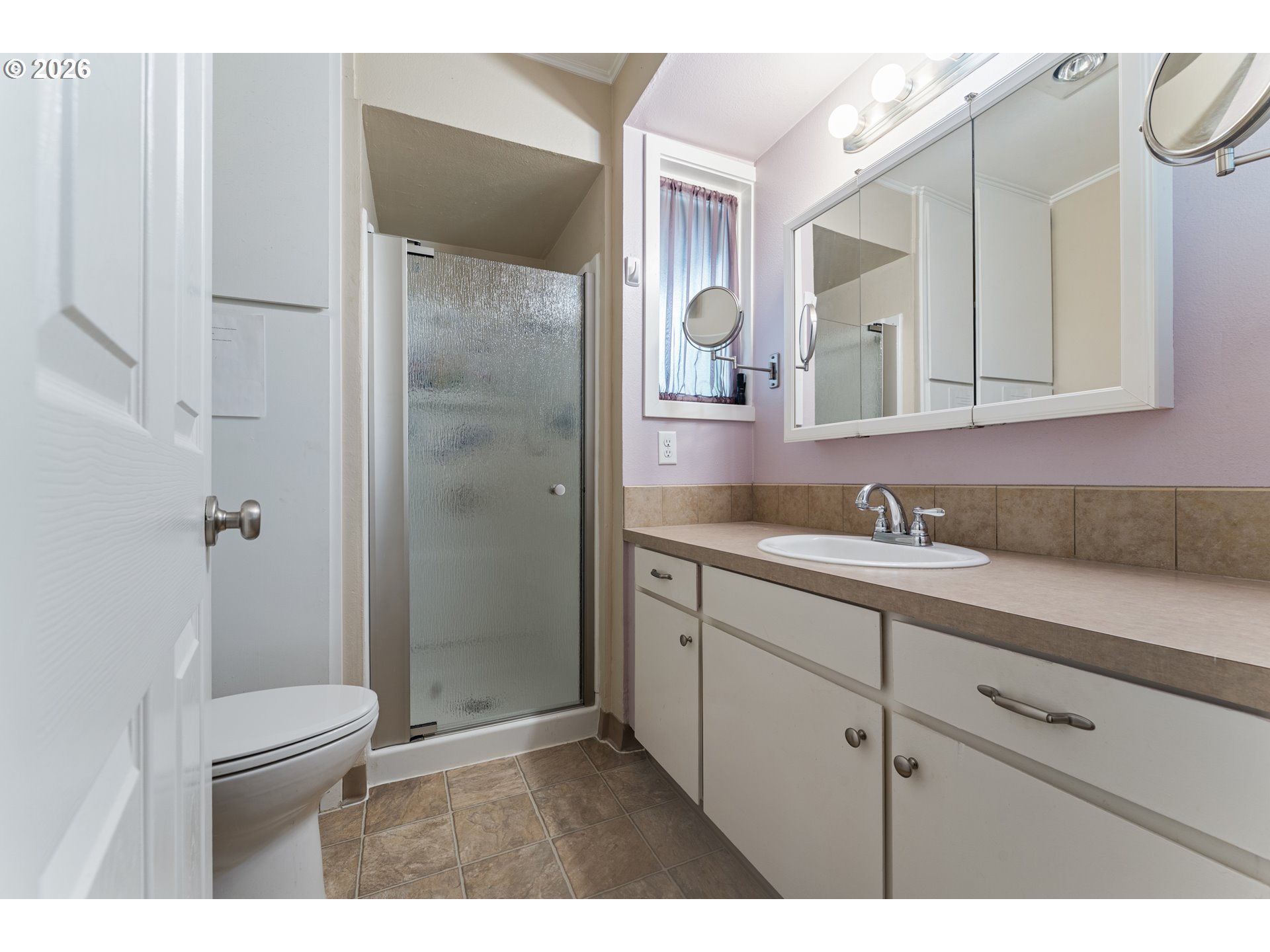 11341 Southwest Springwood Drive Portland, OR 97223 - Photo 18 of 26 a bathroom with a sink a toilet and shower