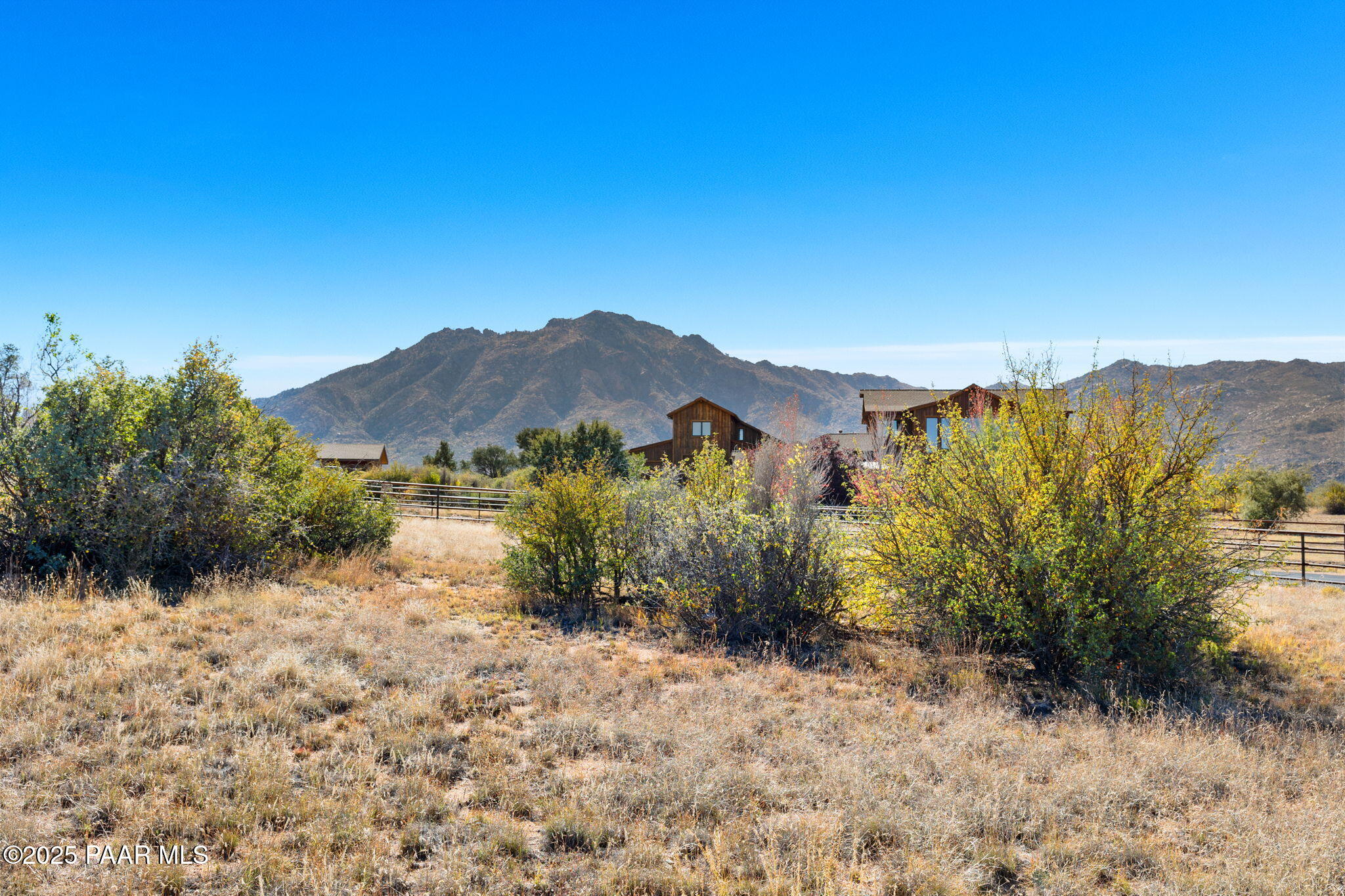 9515 North Equine Road Prescott, AZ 86305 - Photo 22 of 51 a view of a dry yard with mountains in the background