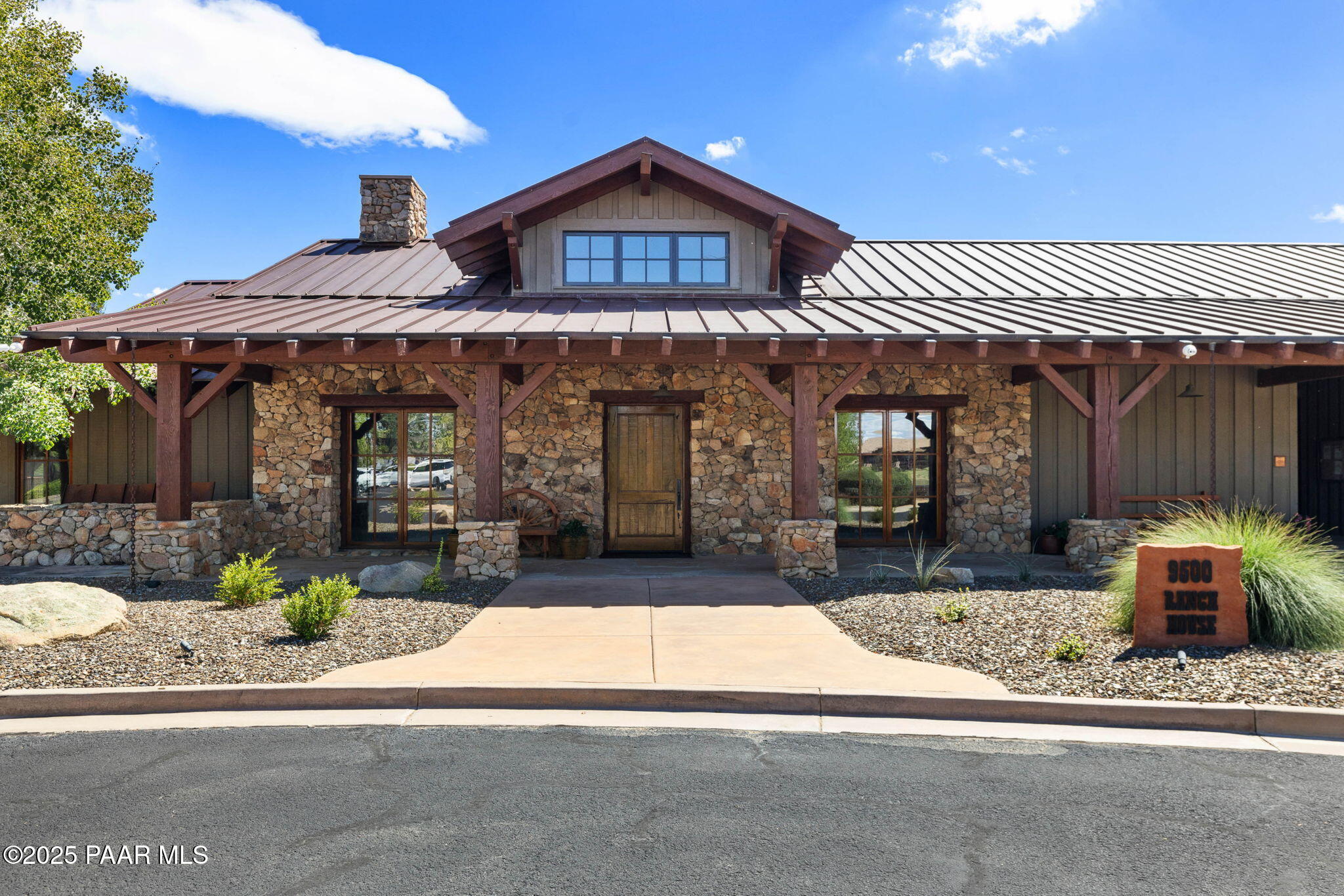 9515 North Equine Road Prescott, AZ 86305 - Photo 26 of 51 a front view of a house with a porch