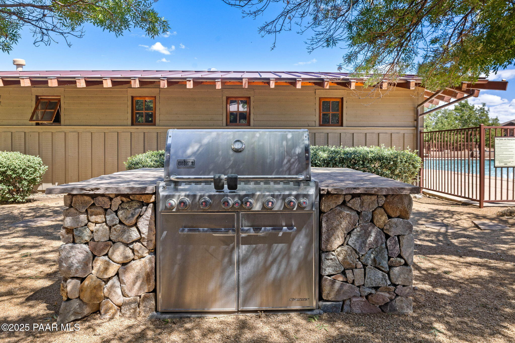 9515 North Equine Road Prescott, AZ 86305 - Photo 32 of 51 a view of a patio with table and chairs with wooden fence