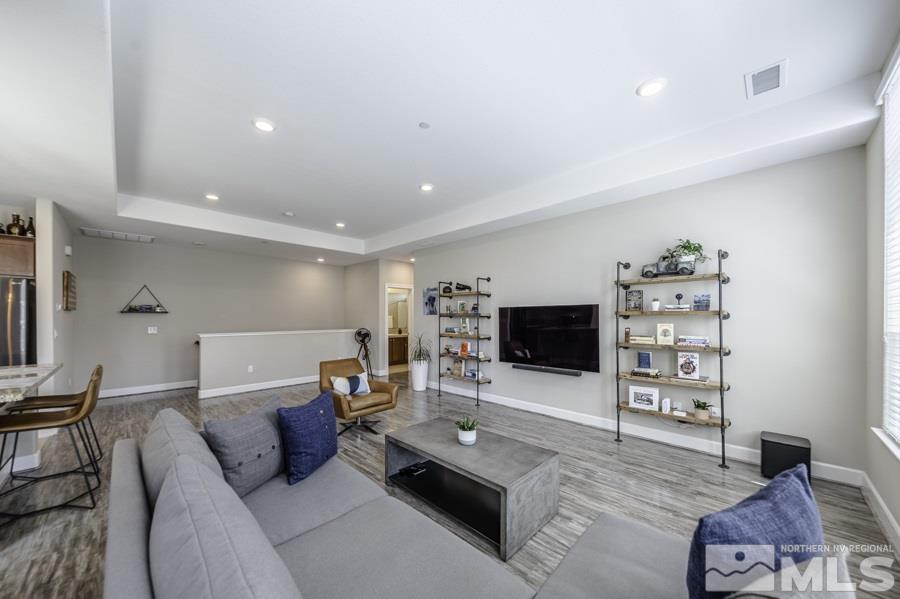 2029 Wind Ranch Road, Unit A Reno, NV 89521 - Photo 12 of 26 a living room with furniture and a flat screen tv