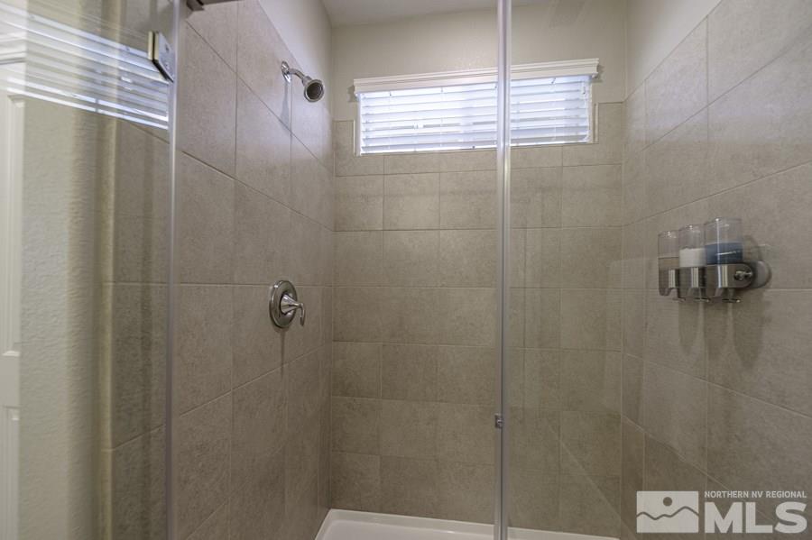 2029 Wind Ranch Road, Unit A Reno, NV 89521 - Photo 16 of 26 a bathroom with a shower
