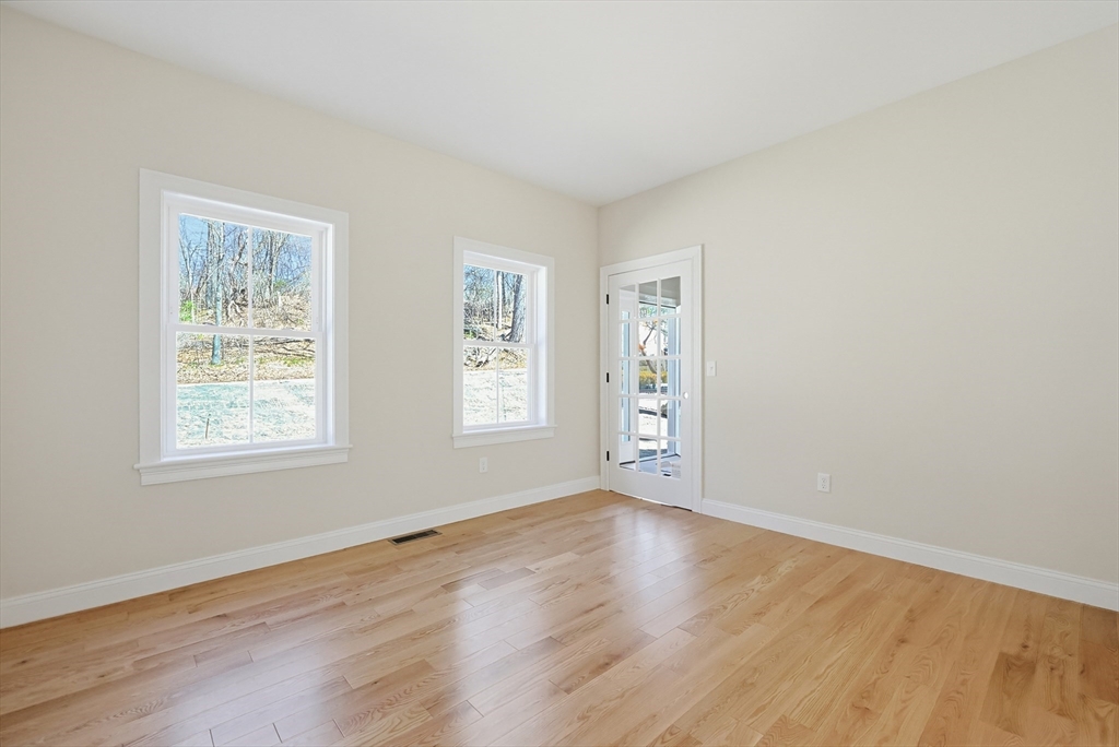 112 West Meadow Road Townsend, MA 01474 - Photo 14 of 38 a view of an empty room with wooden floor and a window