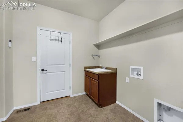 a bathroom with a granite countertop sink a toilet and a mirror