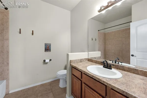 a view of work space with furniture and window