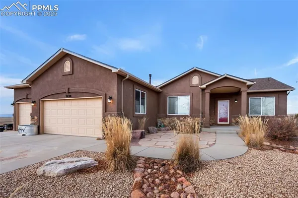a view of a room with furniture and a yard