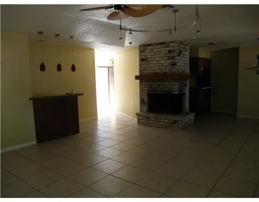 a view of a refrigerator in kitchen