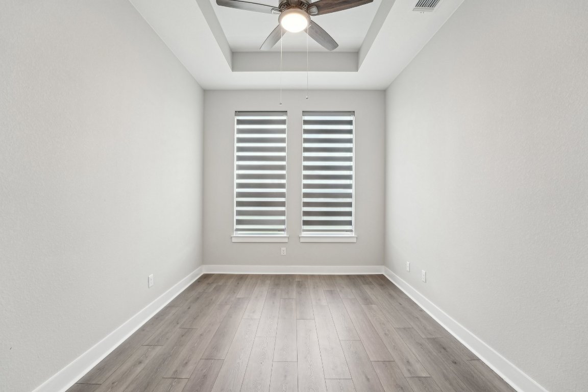 4216 Caroline Mae Cove Pflugerville, TX 78660 - Photo 19 of 32 an empty room with a window