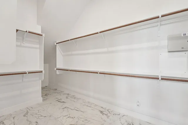 a view of an empty walk in closet